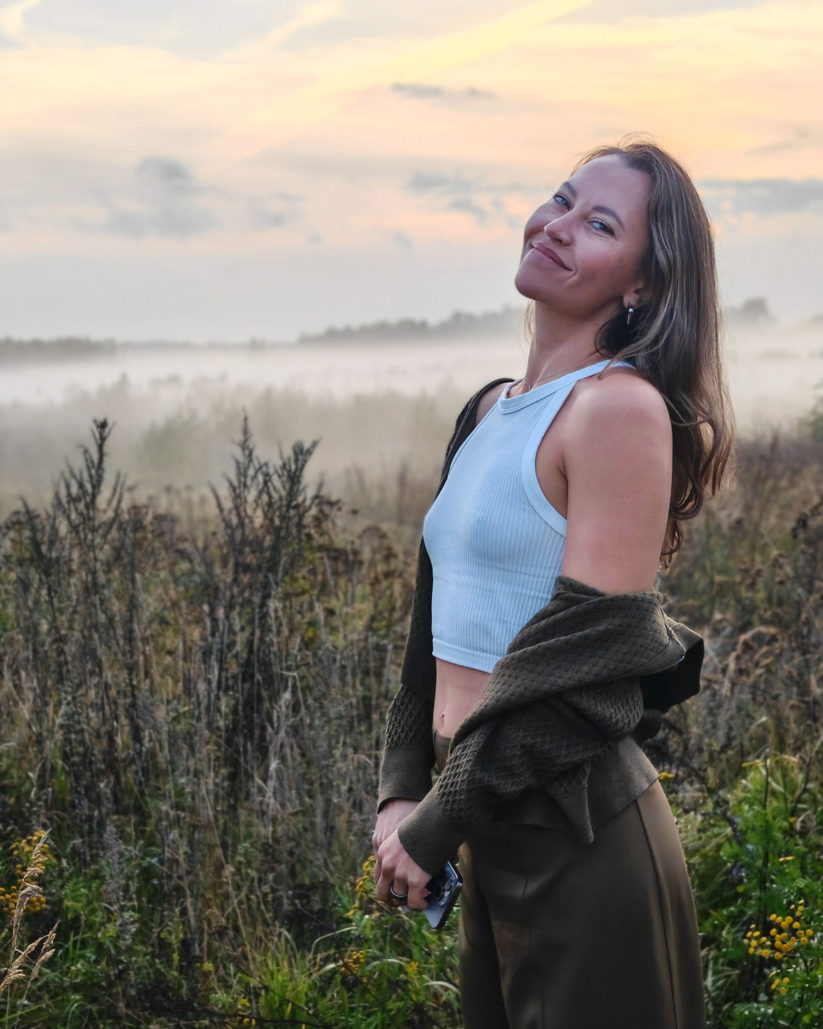 Portrait in a misty meadow at sunset