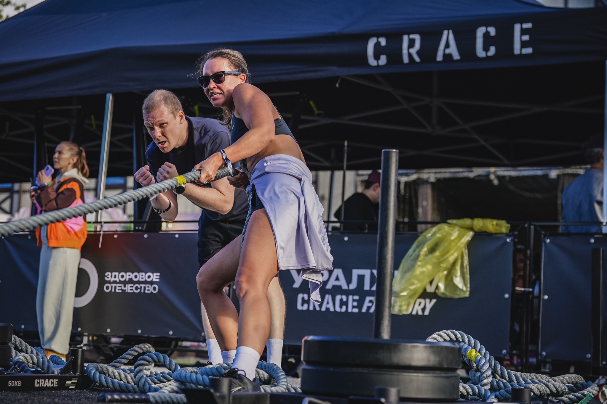 Together at the race, pulling a rope