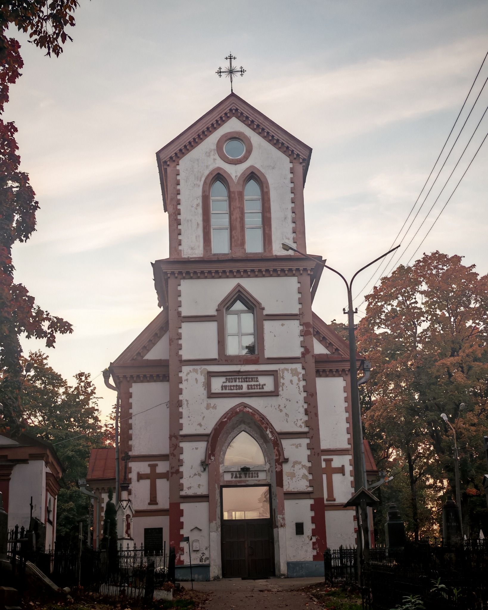 A church framed by autumn trees